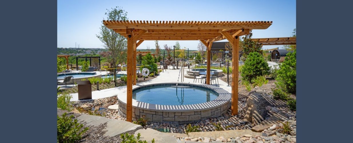 Outdoor pool under pergola outside at WorldSprings The Colony, TX